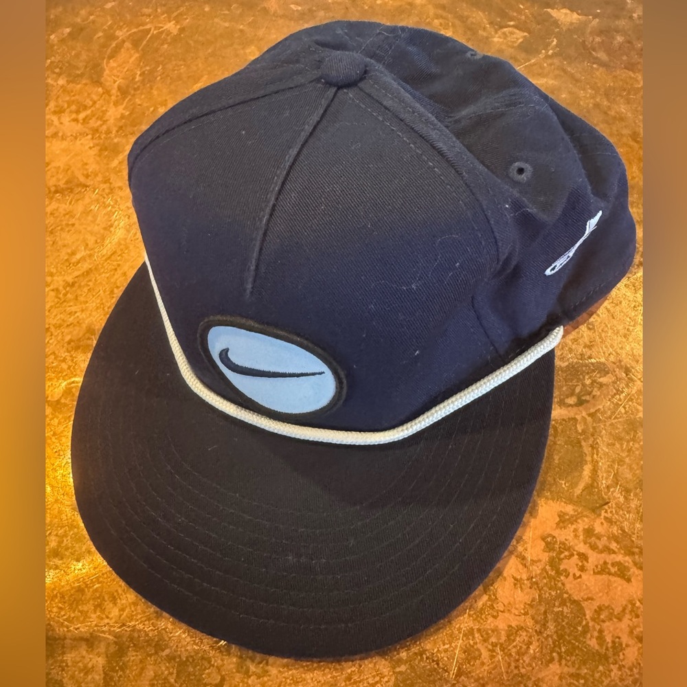 Nike Navy Blue Golf Cap with Logo and front rope design.